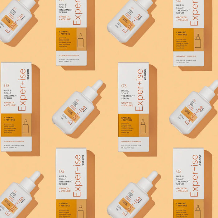 Pattern of 'Expertise' hair care products on a beige background.