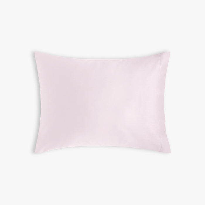 Soft Pink Solid pillow on a white background