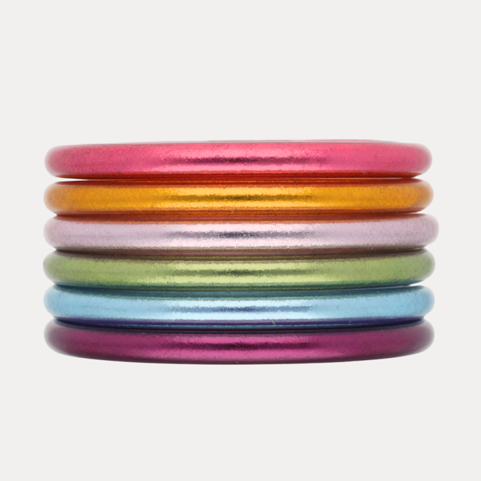 The Afterparty III Stack featuring vibrant multi-color All Weather Bangles® in pink, orange, and purple hues.